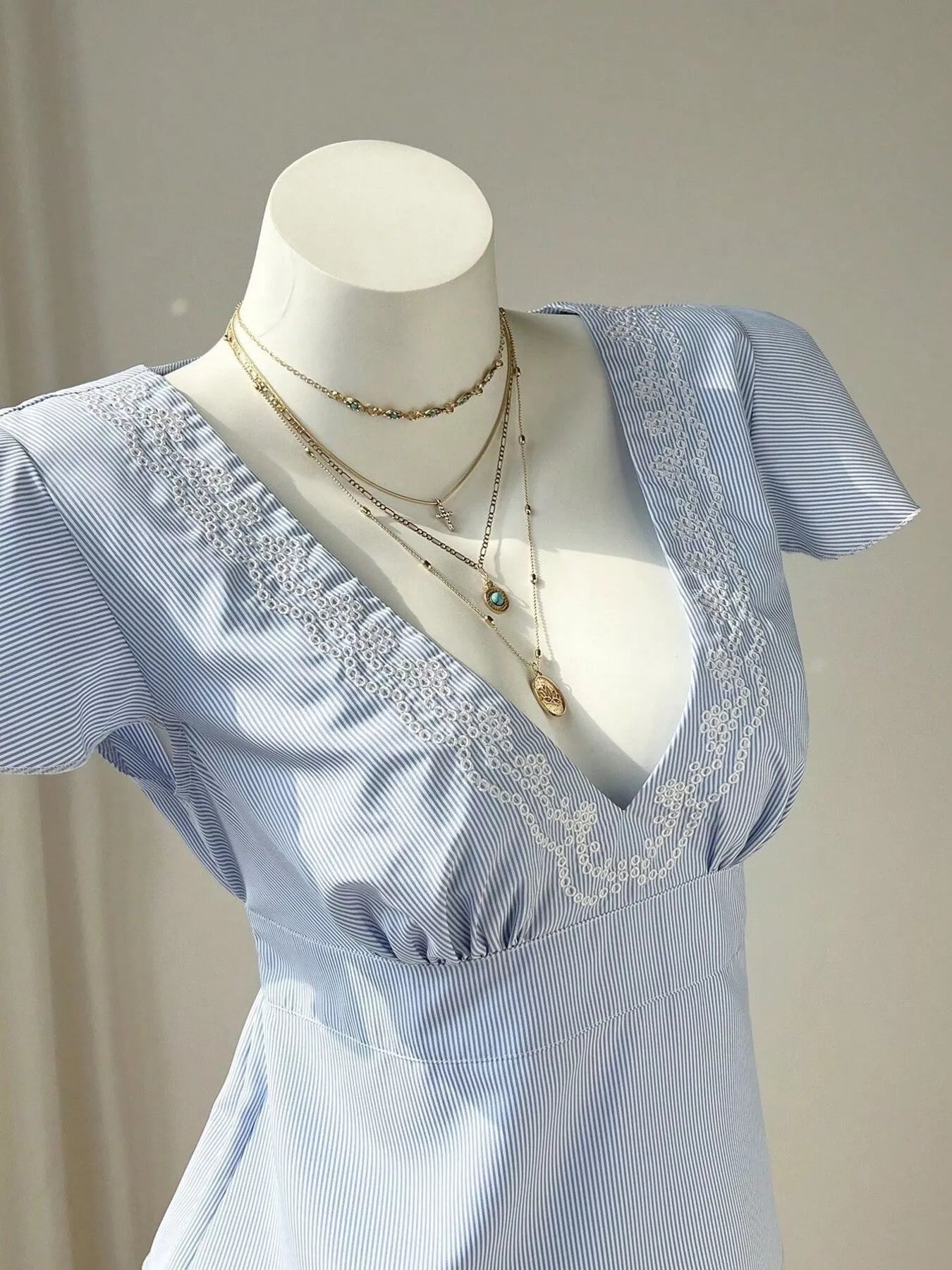 Blue Striped V-Neck Blouse with Delicate White Lace Trim