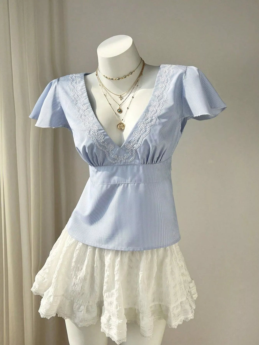 Blue Striped V-Neck Blouse with Delicate White Lace Trim