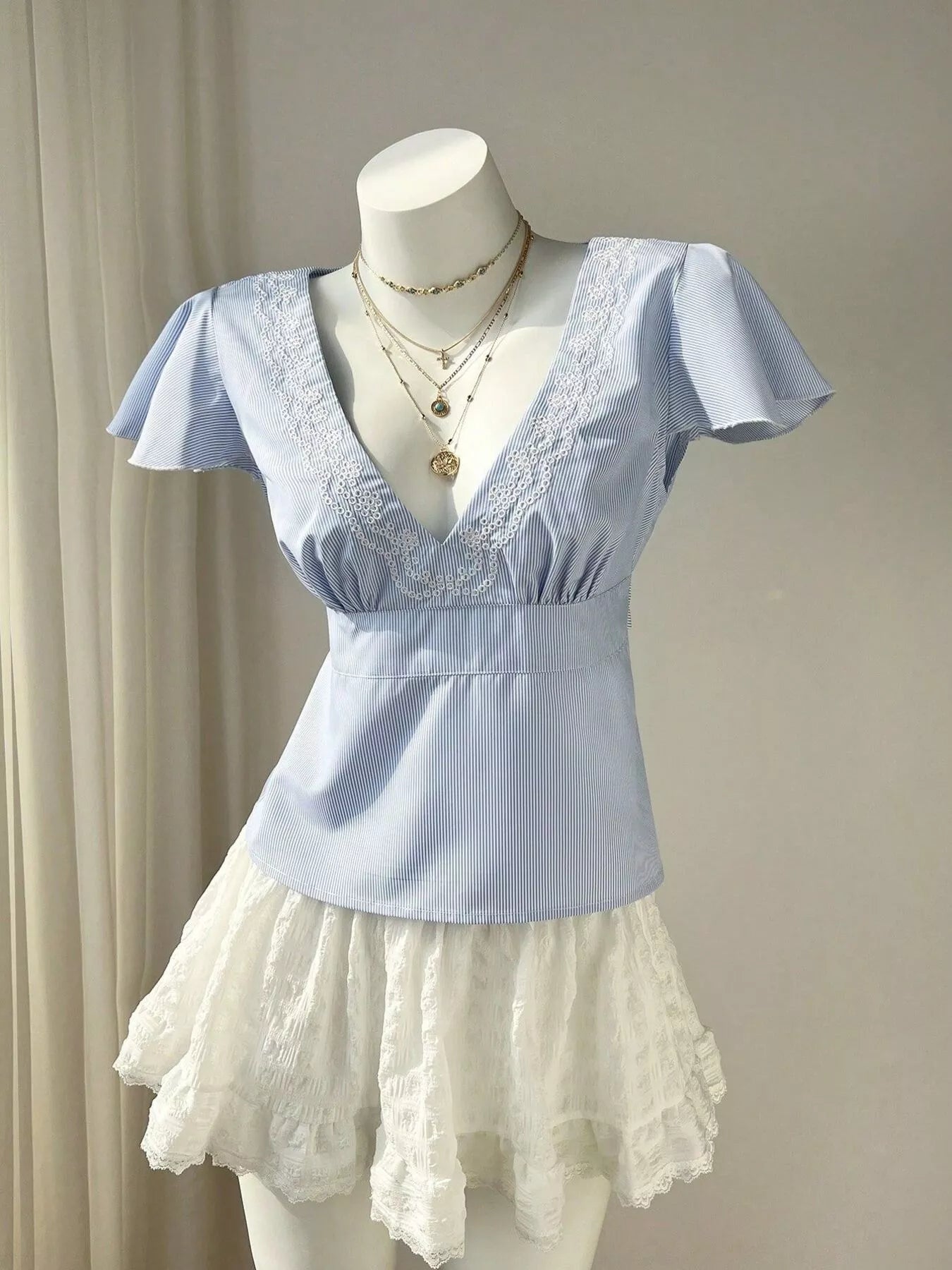 Blue Striped V-Neck Blouse with Delicate White Lace Trim