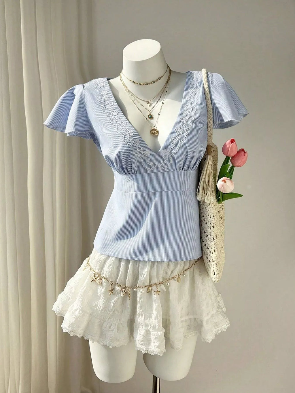 Blue Striped V-Neck Blouse with Delicate White Lace Trim