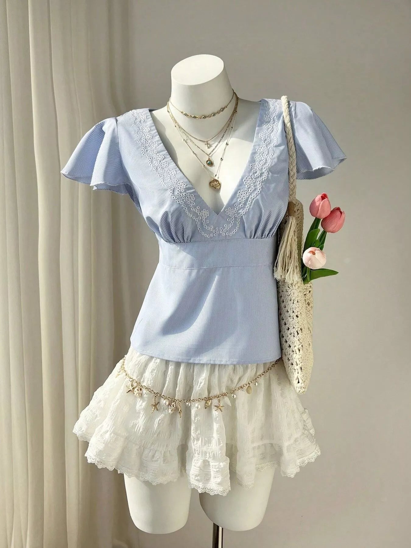 Blue Striped V-Neck Blouse with Delicate White Lace Trim