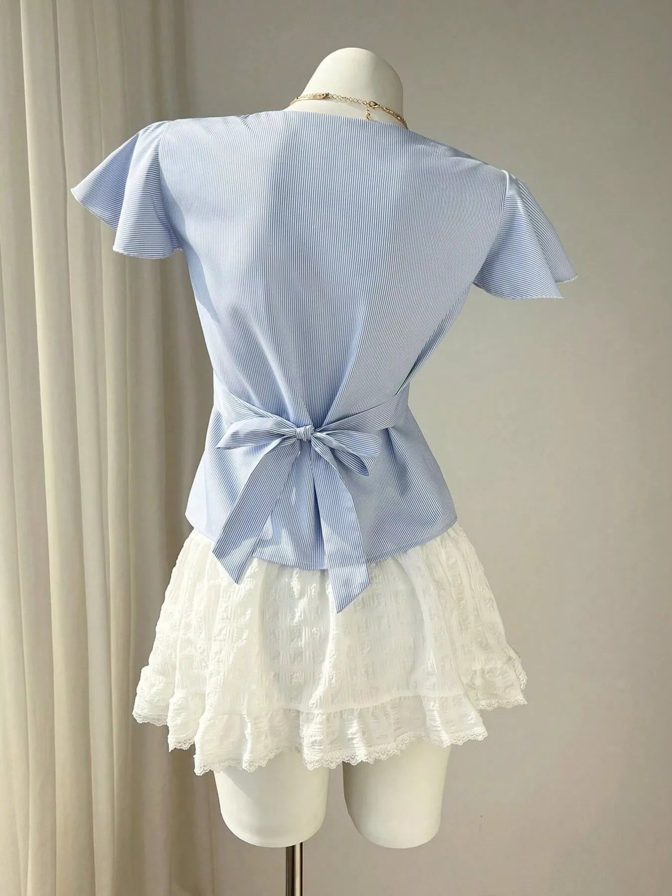 Blue Striped V-Neck Blouse with Delicate White Lace Trim